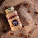 Ole Smoky Moonshine Butter Pecan 750cc. con nueces alrededor